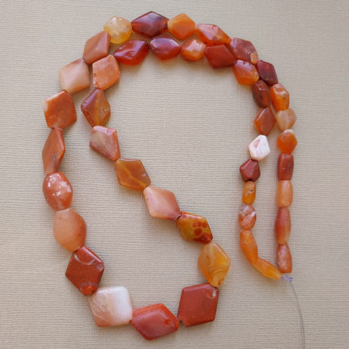 Ancient carnelian stone lozenge shape stone beads from Mali.