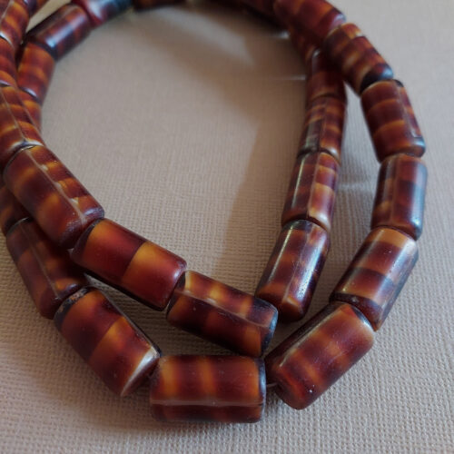 Antique tortoise shell glass trade beads.