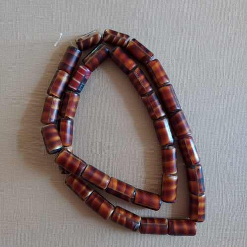 Antique tortoise shell glass trade beads.