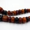 Long strand of phenolic resin amber beads from the African trade.