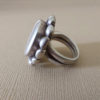 Peul ring of round shape with copper amulet.