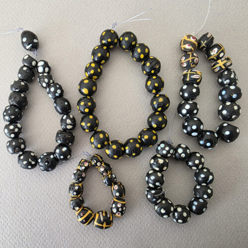Venetian wound glass beads with eyes.