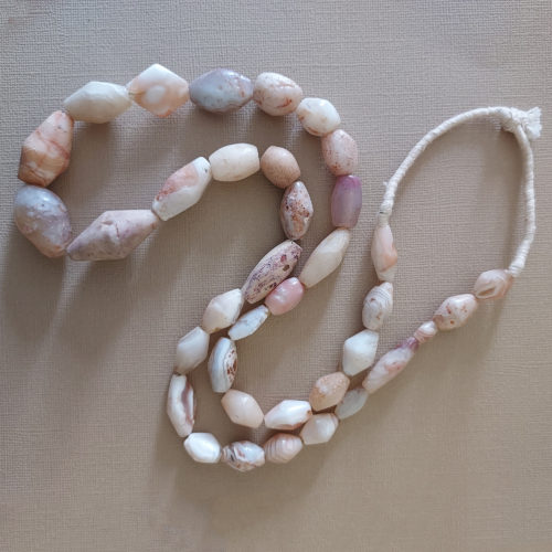 Strand of graduated ancient white quartz beads.