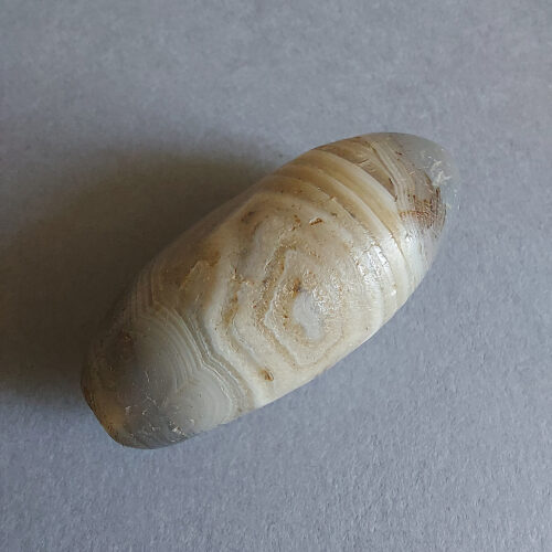 Ancient stone bead of large size.