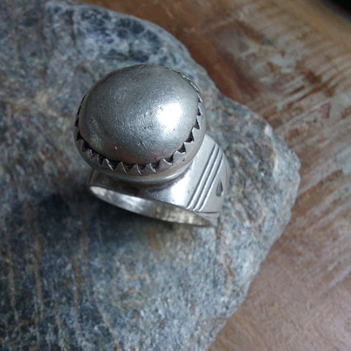 Old Tuareg silver amulet ring with design.