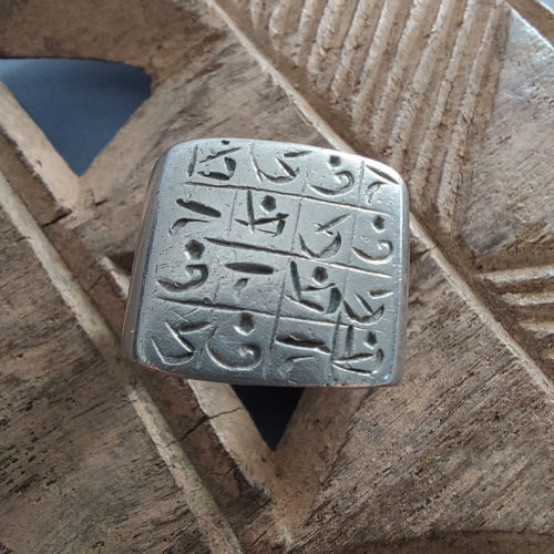 Tuareg silver talisman ring with magic cursive script from Niger.