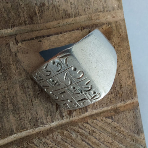 Tuareg silver talisman ring with magic cursive script from Niger.