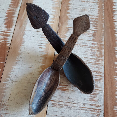 Two old Tuareg wood porridge spoons with a geometric pattern.
