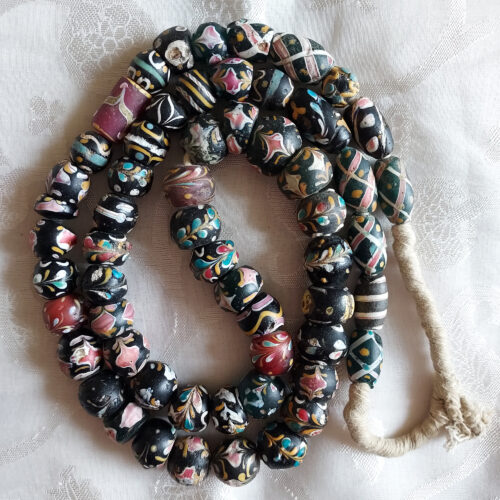 Venetian fancy beads trade beads with floral trailed decoration.