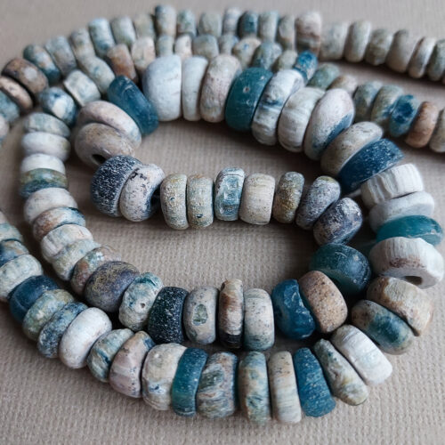 Ancient Nila glass beads with rich iridescent patina from Mali.