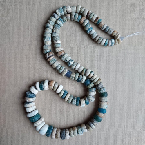 Ancient Nila glass beads with rich iridescent patina from Mali.