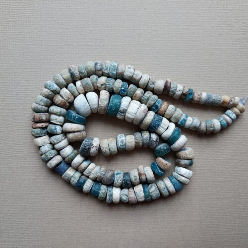 Ancient Nila glass beads with rich iridescent patina from Mali.