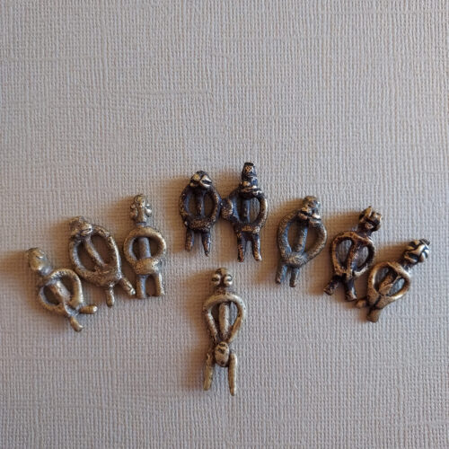 Authentic Lobi metal figure pendants with a nice patina.