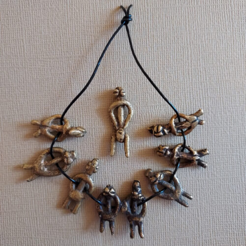 Authentic Lobi metal figure pendants with a nice patina.