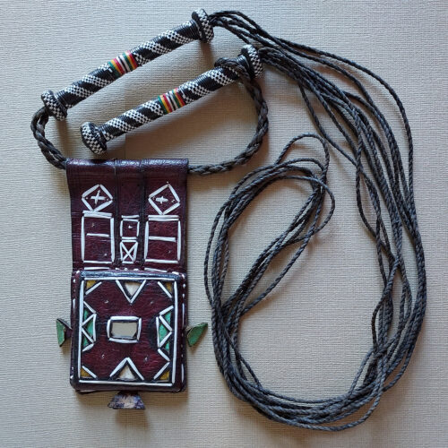 Wodaabe embroidered amulet with mirror against the evil eye.