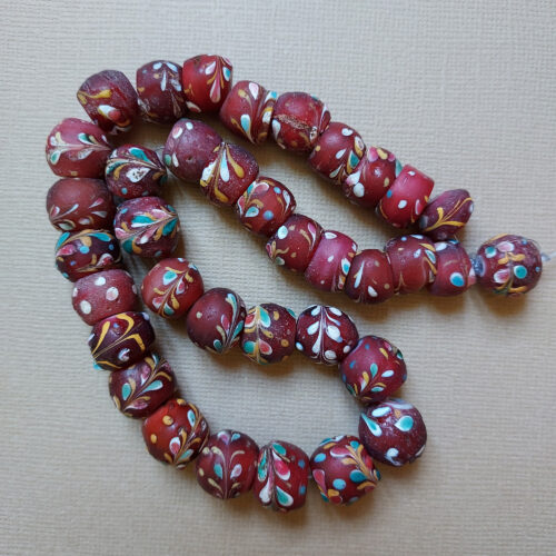 Antique Venetian decorated trade beads with trail decoration.