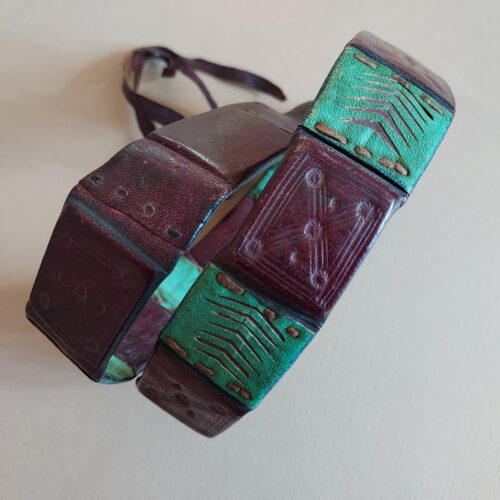 A leather belt from Niger with eight amulets.