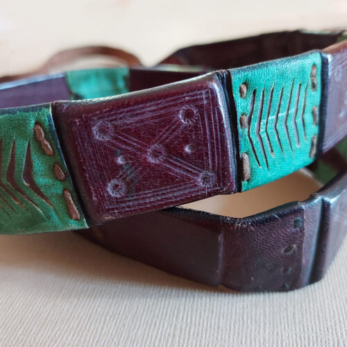 A leather belt from Niger with eight amulets.