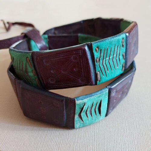 A leather belt from Niger with eight amulets.