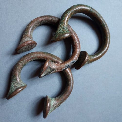 African Okpoho horseshoe currency bracelets with vert de gris patina.