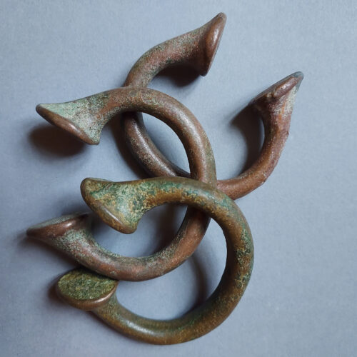 African Okpoho horseshoe currency bracelets with vert de gris patina.