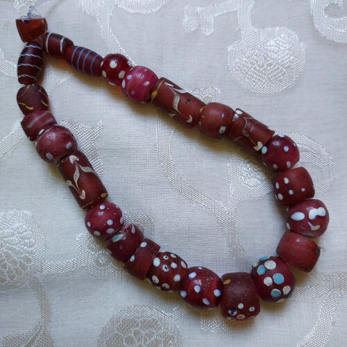 Antique Venetian red eye beads from the African trade.