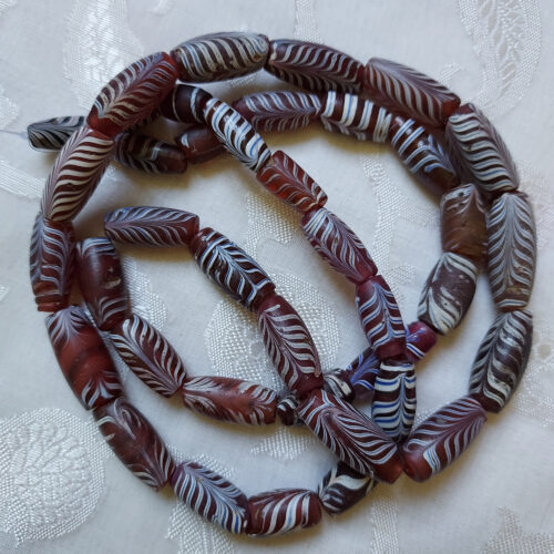 Antique Venetian feather beads from Mali.