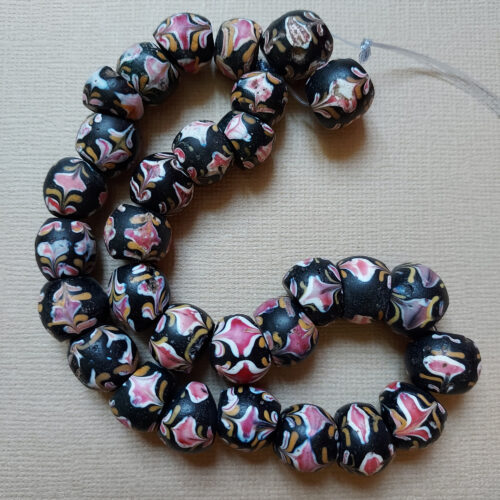 Venetian fancy beads trade beads with floral trailed decoration.