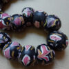 Venetian fancy beads trade beads with floral trailed decoration.