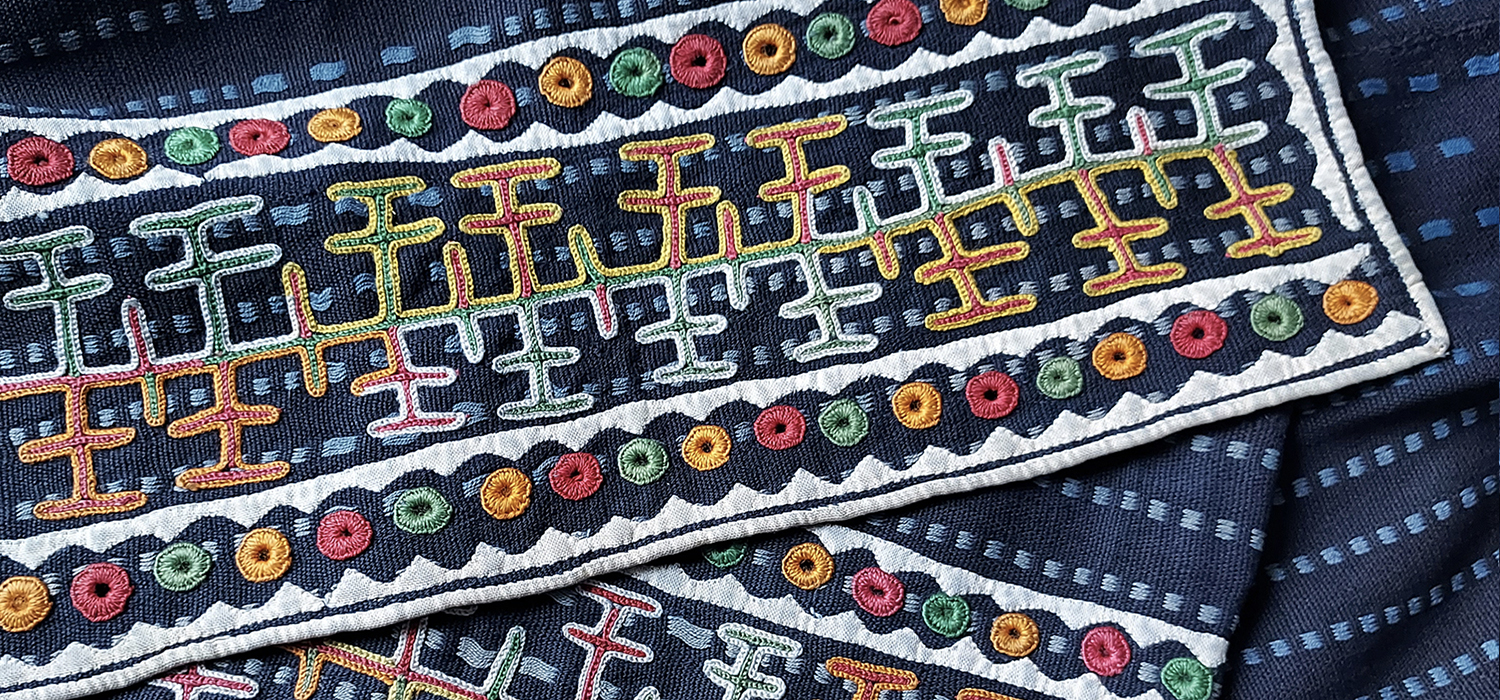 Wodaabe woven indigo cloth with colourful traditional embroidery from Niger.