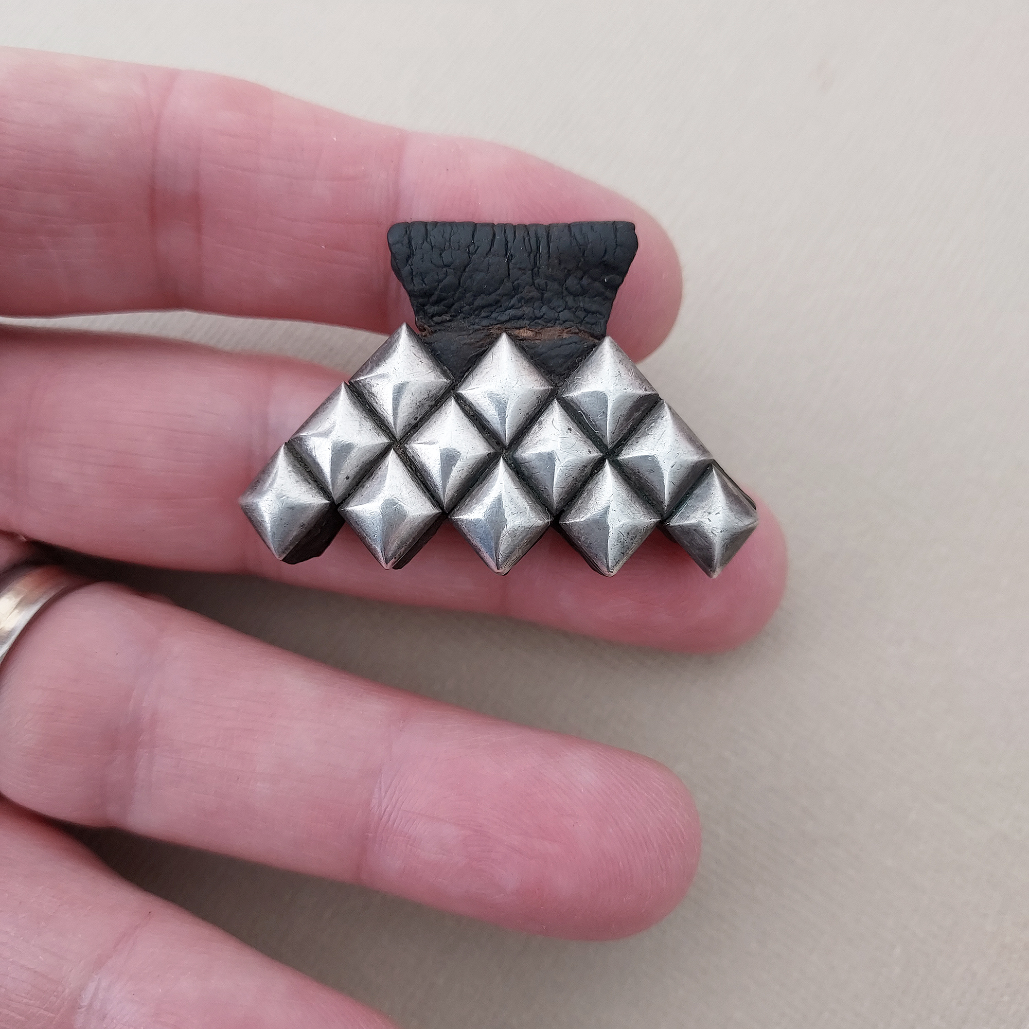 silver and leather hand of fatima pendant