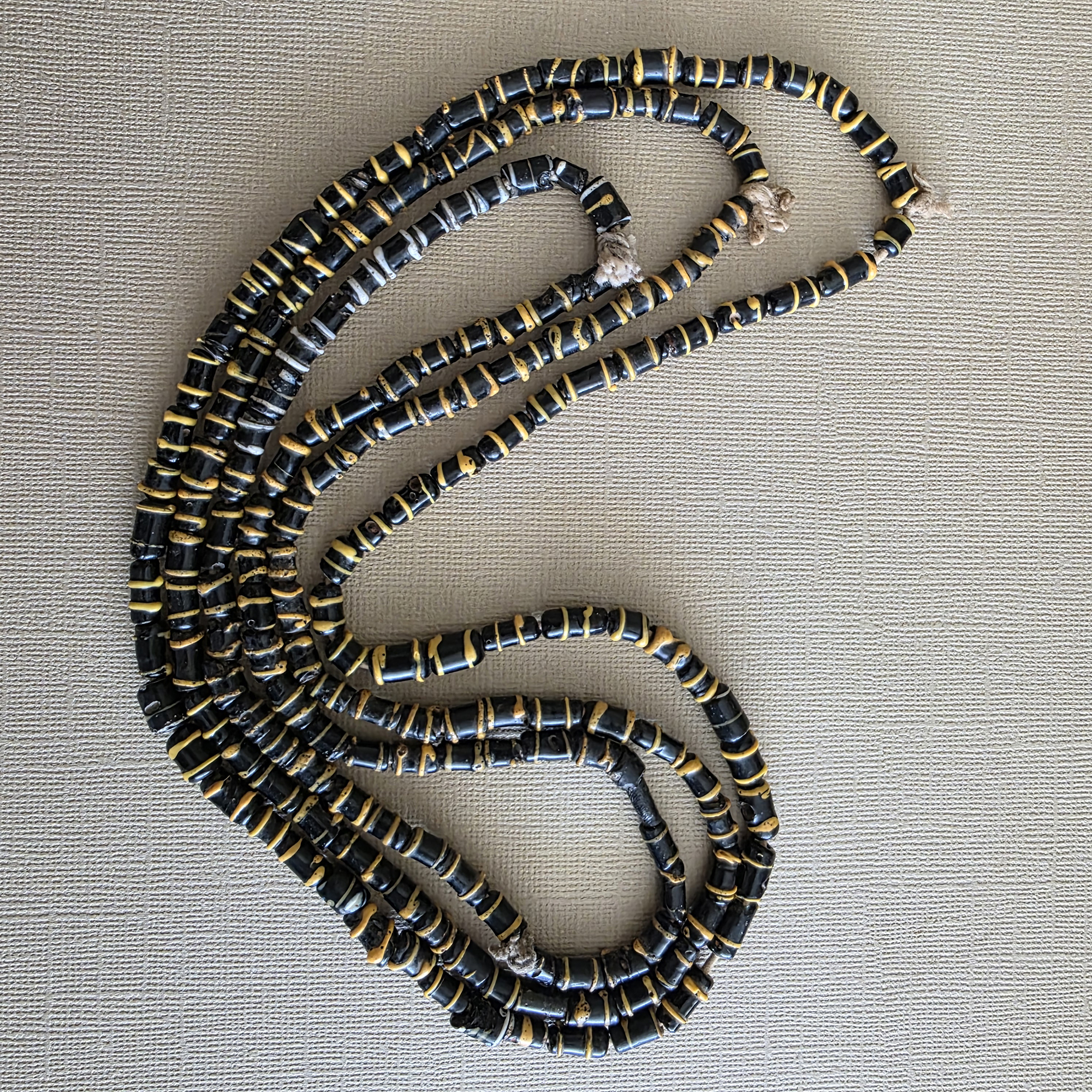 Small antique cylinder beads