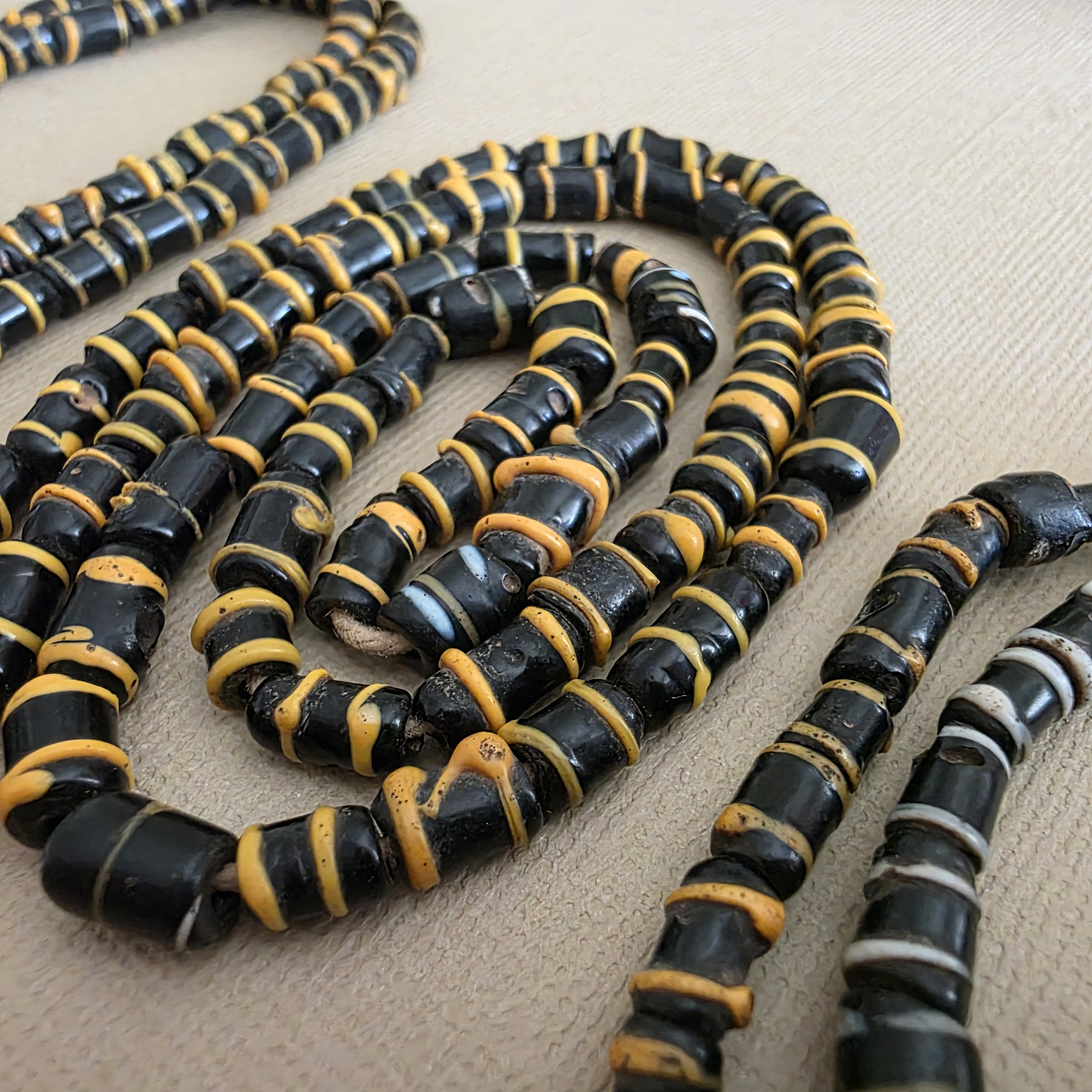 Small antique cylinder beads