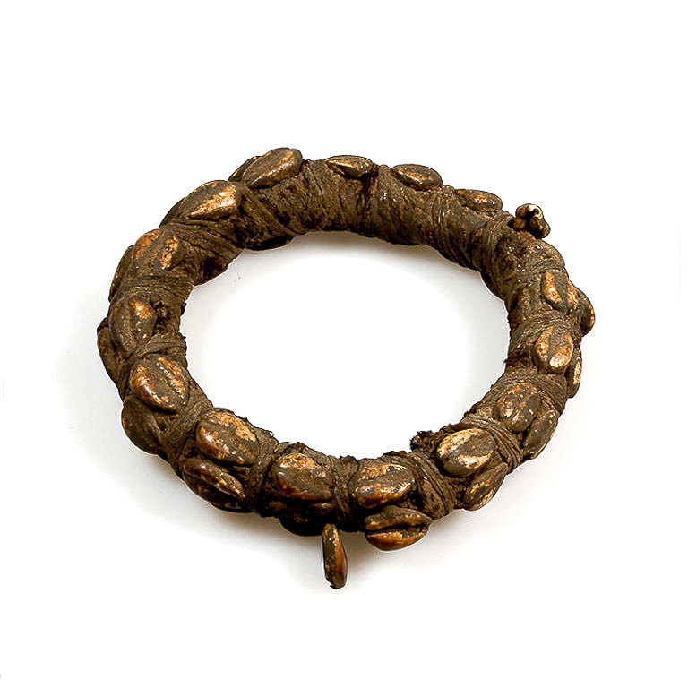 Lobi bracelet with magic amulet for the upper arm adorned with cowrie shells from Burkina Faso.