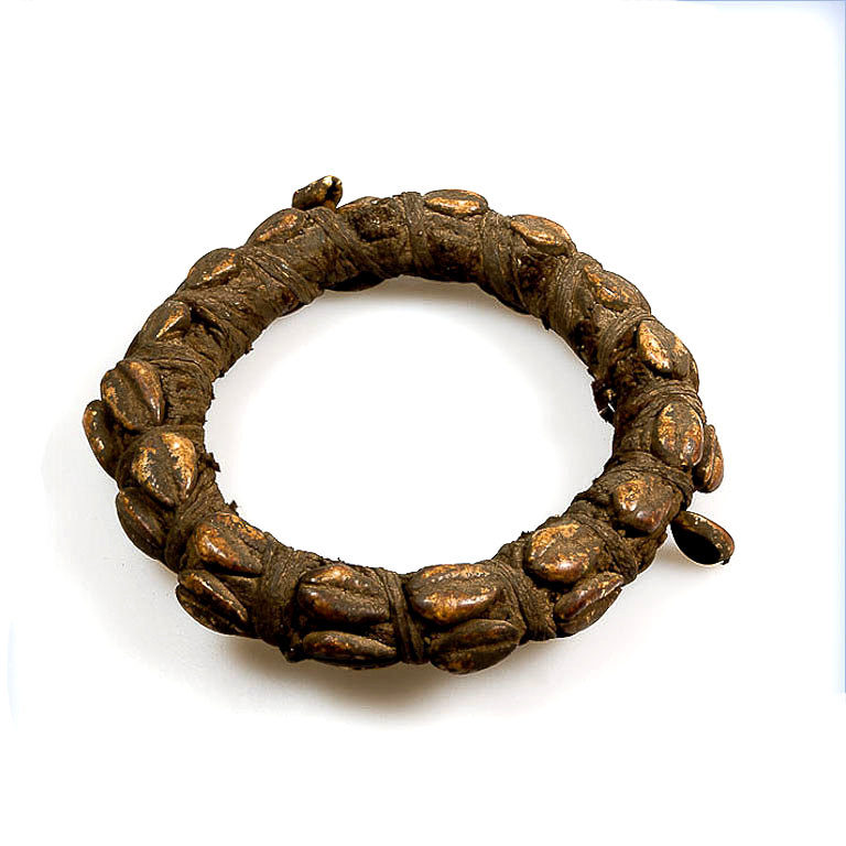 Lobi bracelet with magic amulet for the upper arm adorned with cowrie shells from Burkina Faso.